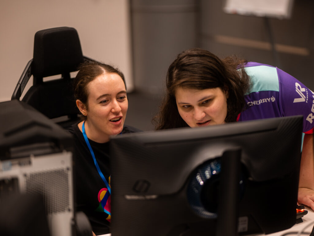 two persons playing league of legends and helping each other